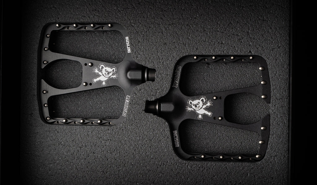 Dropbear Incisor flat pedal pair viewed from above, showing both platforms inside foam inserts