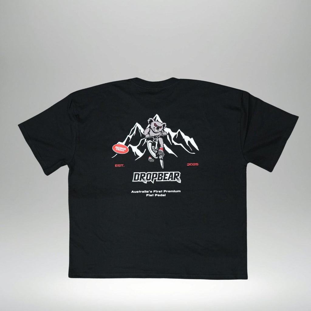 Black t-shirt with white graphic design on a gray background