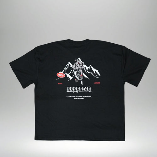 Black t-shirt with white graphic design on a gray background